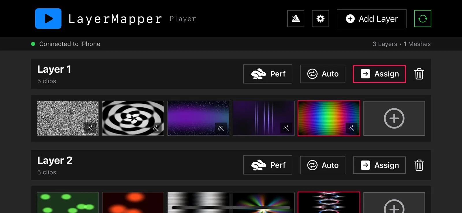 LayerMapper Player on iPhone connected to an iPhone controller, showing layers of clips