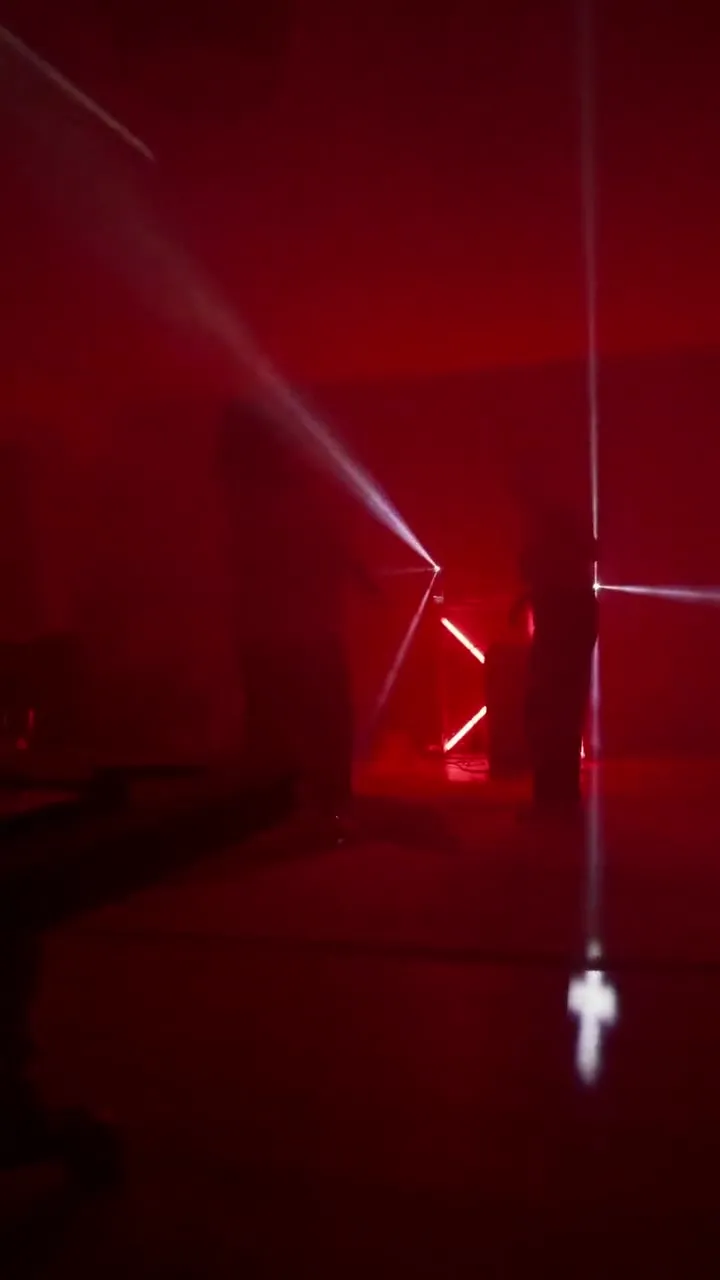 Projection lasers in a hazy room – an ordinary projector, no laser hardware.